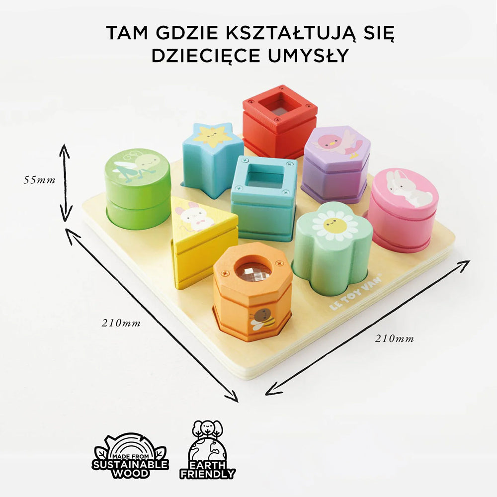 Drewniany sorter kształtów i klocków Le Toy Van z 9 kolorowymi, ilustrowanymi klockami sensorycznymi na tacy (210x210x55mm). Edukacyjna zabawka rozwijająca motorykę małą, wykonana ze zrównoważonego drewna.