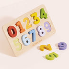 Drewniany sorter cyferek Le Toy Van: kolorowa układanka edukacyjna z liczbami 0-9 na drewnianej tacy. Idealna zabawka do nauki liczenia i rozpoznawania kształtów dla dzieci.