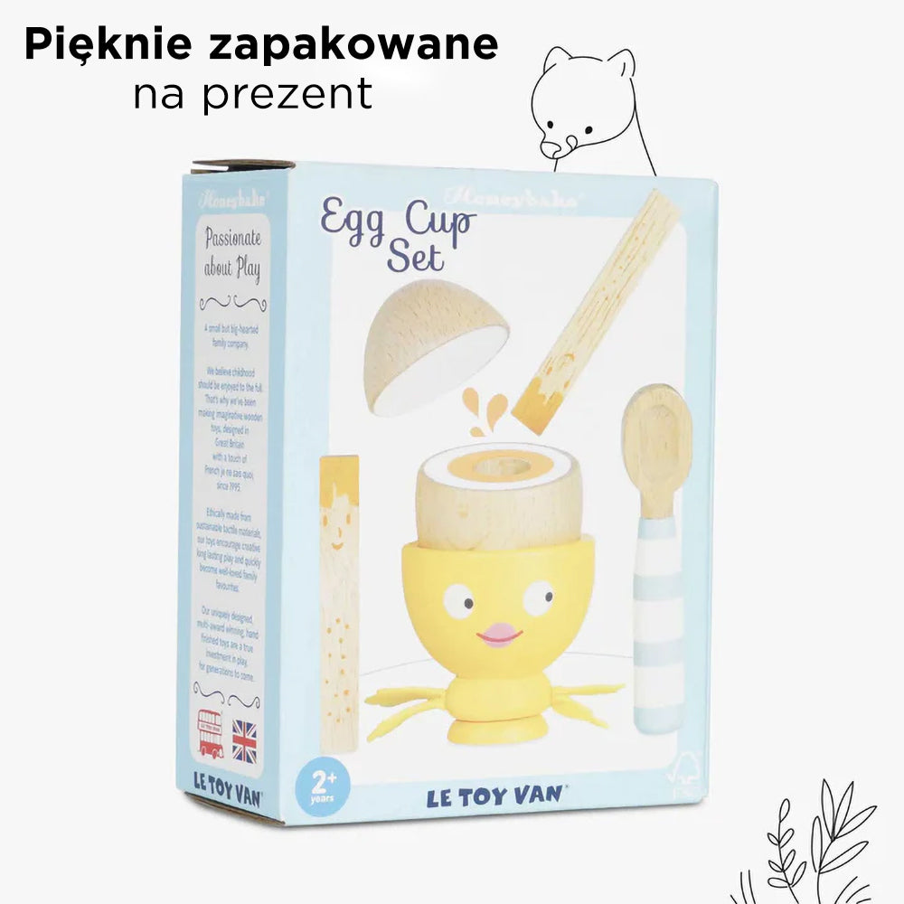 Opakowanie drewnianego zestawu Le Toy Van Honeybake Drewniany kieliszek do jajka i jajko, zawierające kurczaczka, magnetyczne jajko, mieszadełka i łyżeczkę. Pięknie zapakowane na prezent dla dzieci.