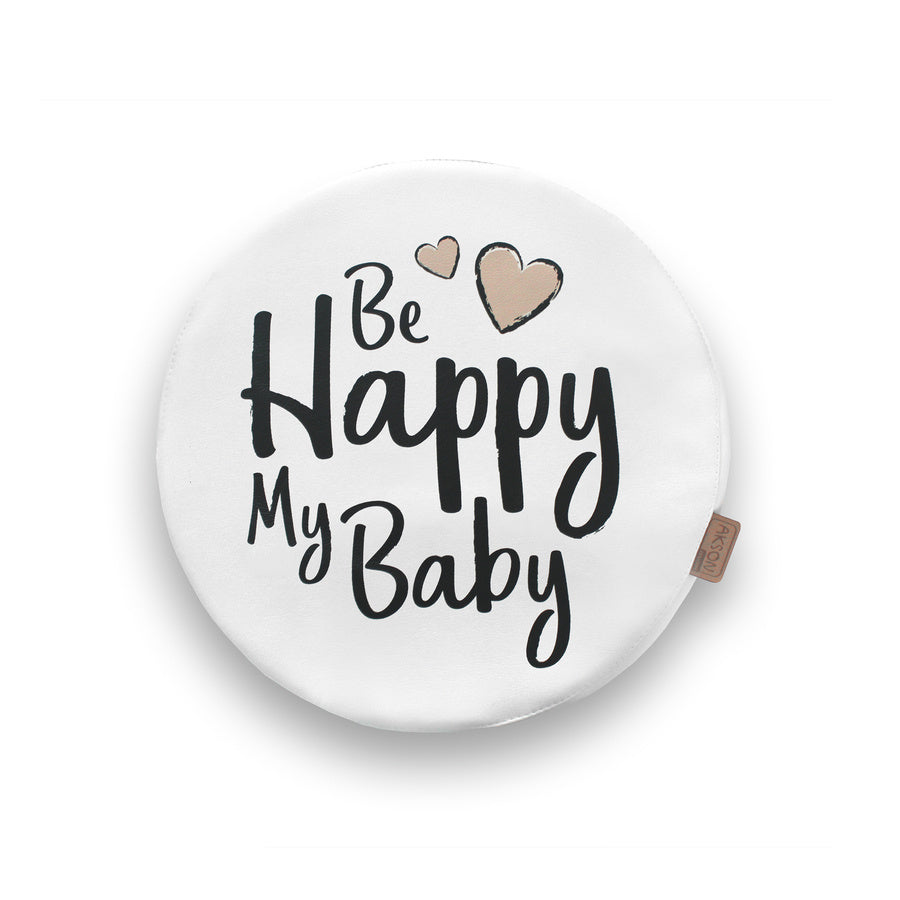 Biała okrągła poduszka z ekoskóry z napisem "Be Happy My Baby" i beżowymi serduszkami, idealna do pokoju dziecka lub kącika zabaw.